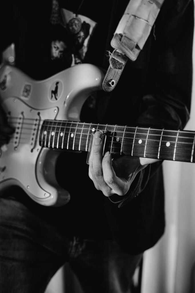 Grayscale Photo of Electric Guitar